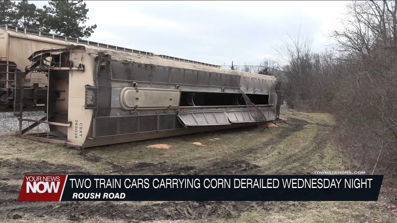Two train cars carrying corn derailed Wednesday night